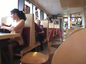 Big titted young woman flashing in a restaurant