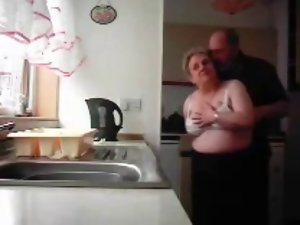 Grandma and grandpa banging in the kitchen