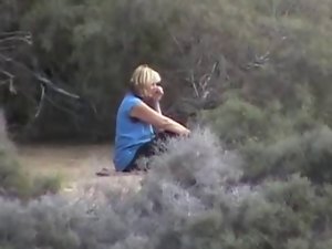 Slutty wife at the beach looking at nude men. Husband films.