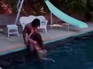Black nympho blowjobing in the pool