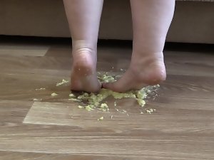 Mommy crushes a banana naked feet